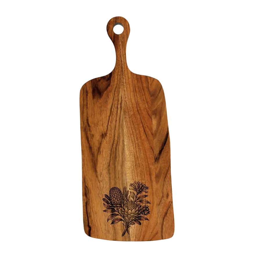 A rectangular wooden cutting board with a rounded handle and a hanging hole, featuring a dark engraved botanical design near the bottom. The board is made of medium brown wood with prominent grain patterns and is photographed on a clean white background.