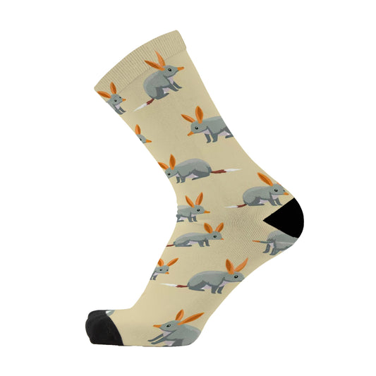 Colourful bamboo socks featuring Bilbies on a light brown background.