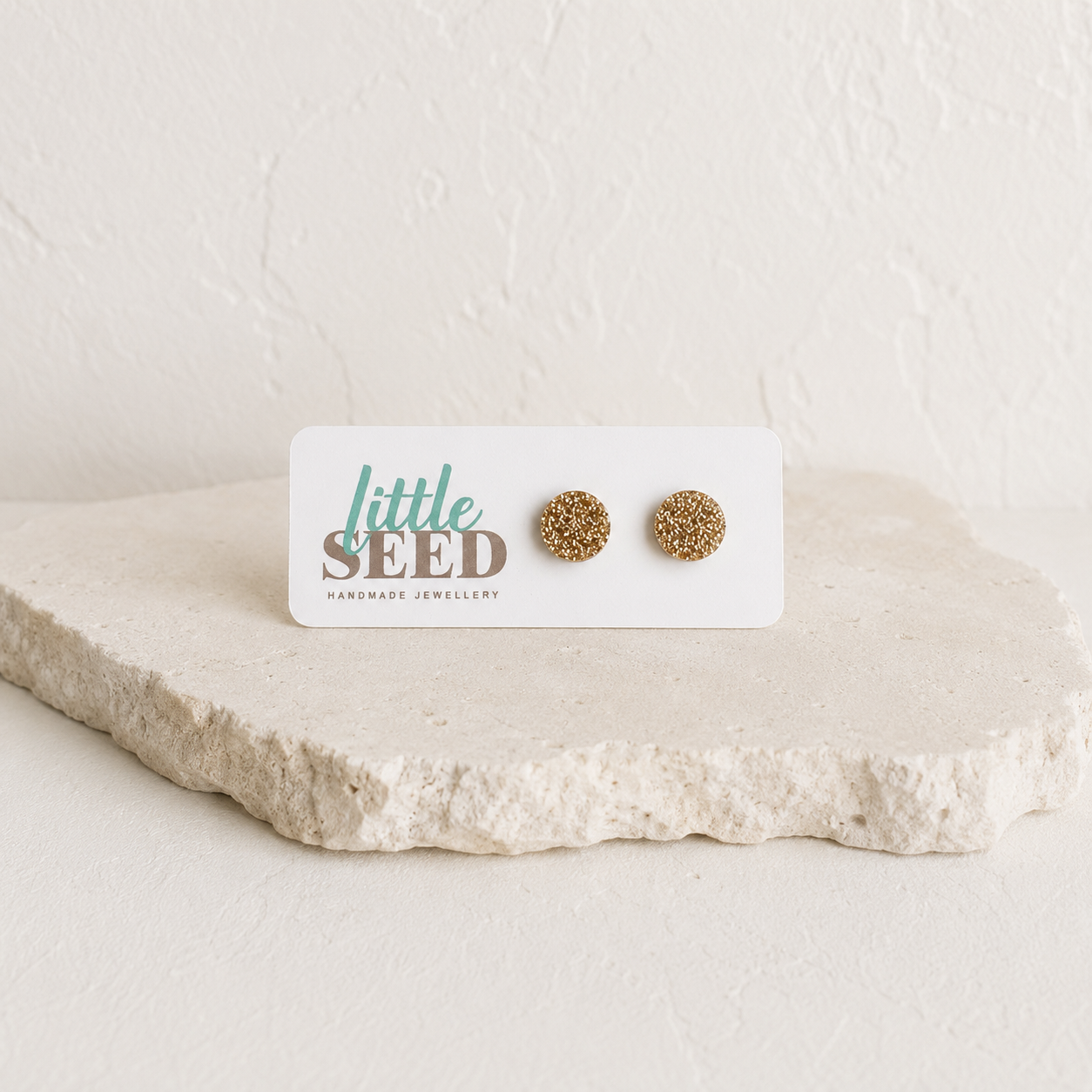 Fine glitter acrylic stud earrings handmade by Little Seed available in Pink, Purple, Gold and Silver.