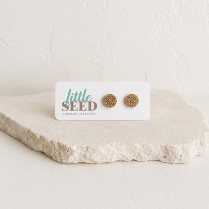 Fine glitter acrylic stud earrings handmade by Little Seed available in Pink, Purple, Gold and Silver.