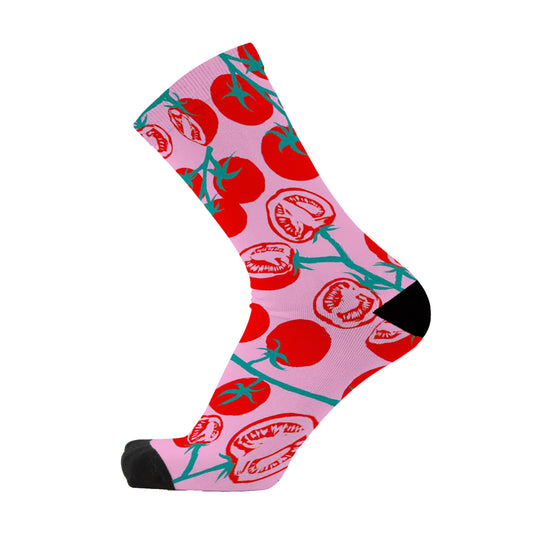 Colourful bamboo socks featuring a red cherry tomato design on a pink background.