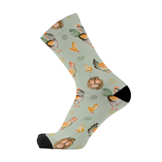 Farm animal bamboo socks featuring chicken and eggs on a blue grey background.