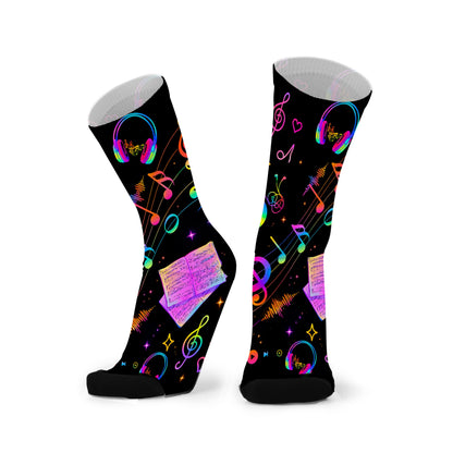 Colourful bamboo socks featuring rainbow music notes and headphones on a black background.