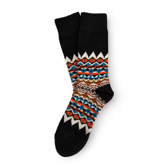 Pair of socks with a colorful pattern on a white background. Scandinavian Style Socks for winter 
