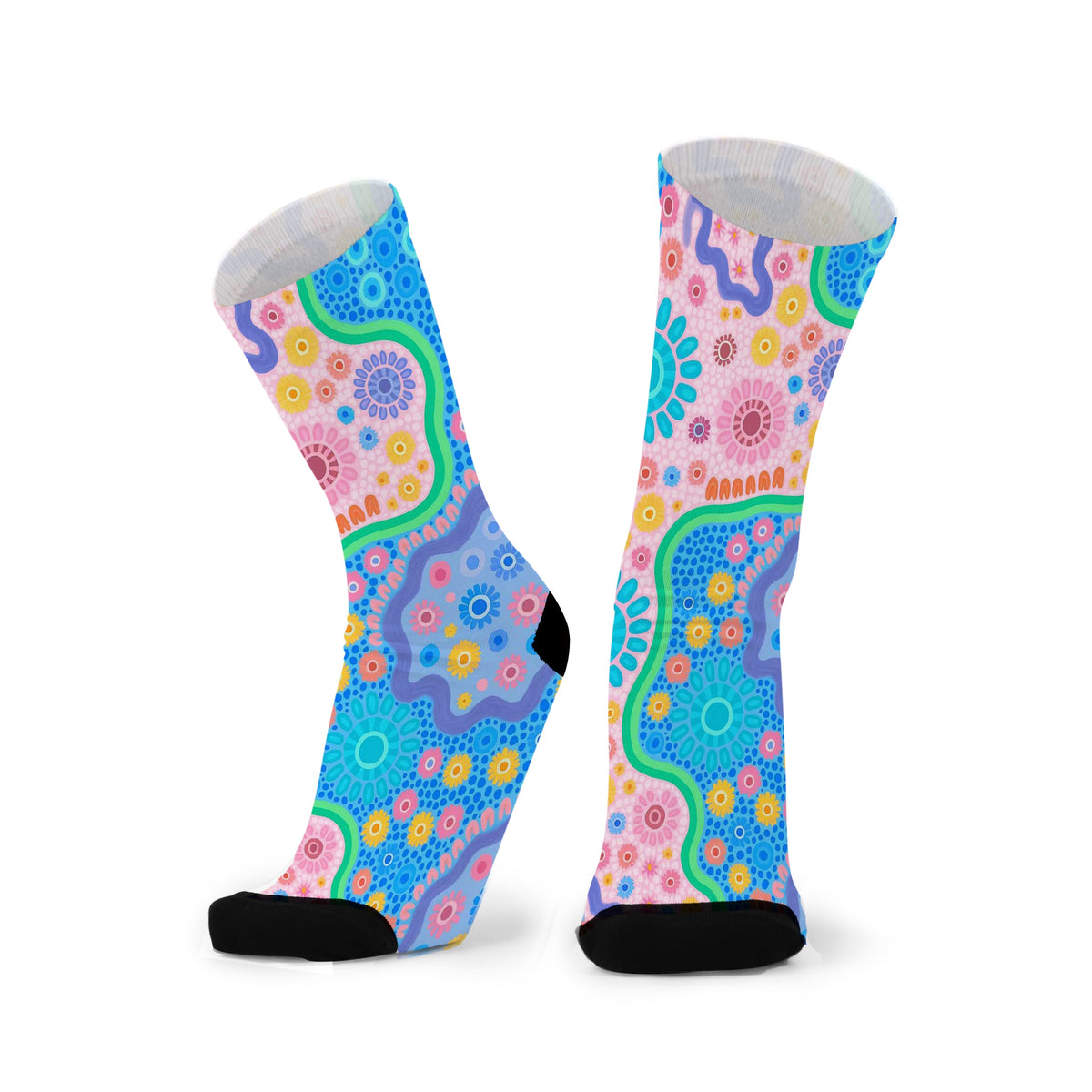 Colorful patterned socks on a white background.Designed by Caitlin Trindall