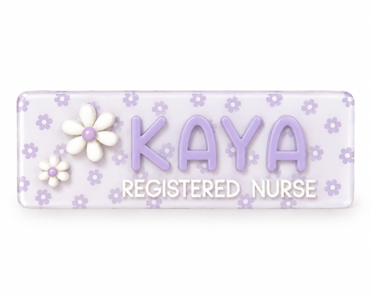 Personalised lavender daisy name badge reading 'Kaya – Registered Nurse' with raised 3D lettering and white flowers