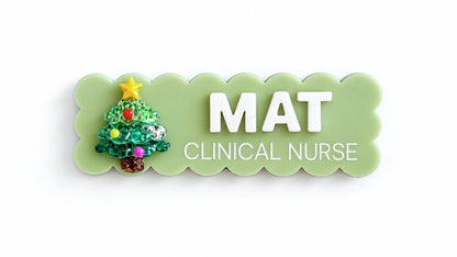 Light green scalloped Christmas name badge with tree charm reading Mat, Clinical Nurse