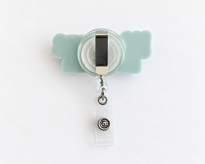 Back of the personalised name badge reel showing the metal clip, retractable cord and clear ID card strap with snap