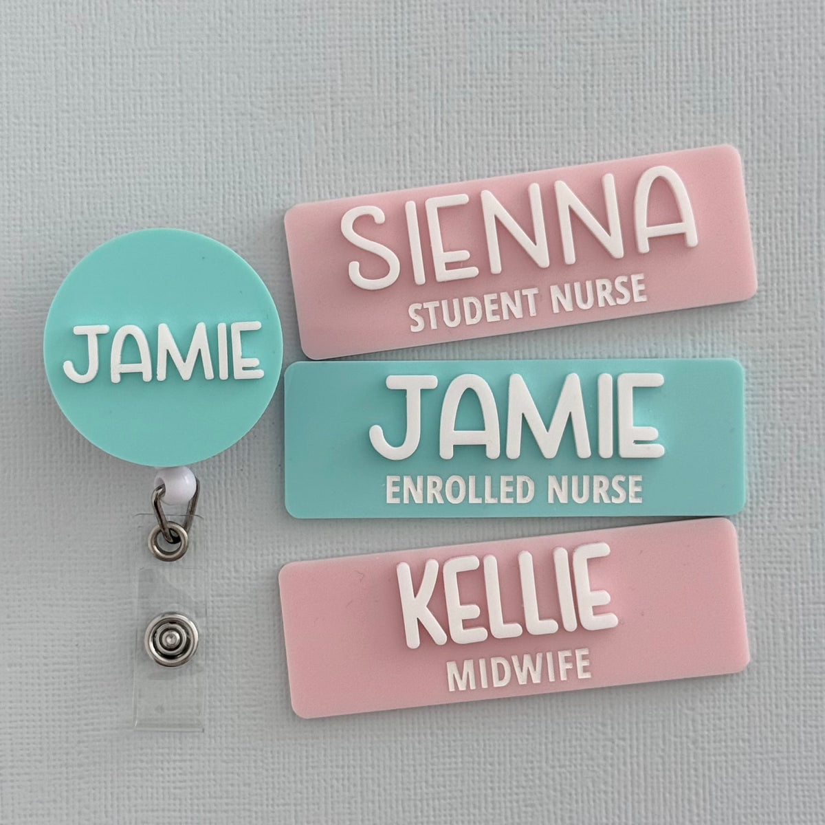 Pastel personalised name badges and matching badge reel: Sienna Student Nurse, Jamie Enrolled Nurse and Kellie Midwife