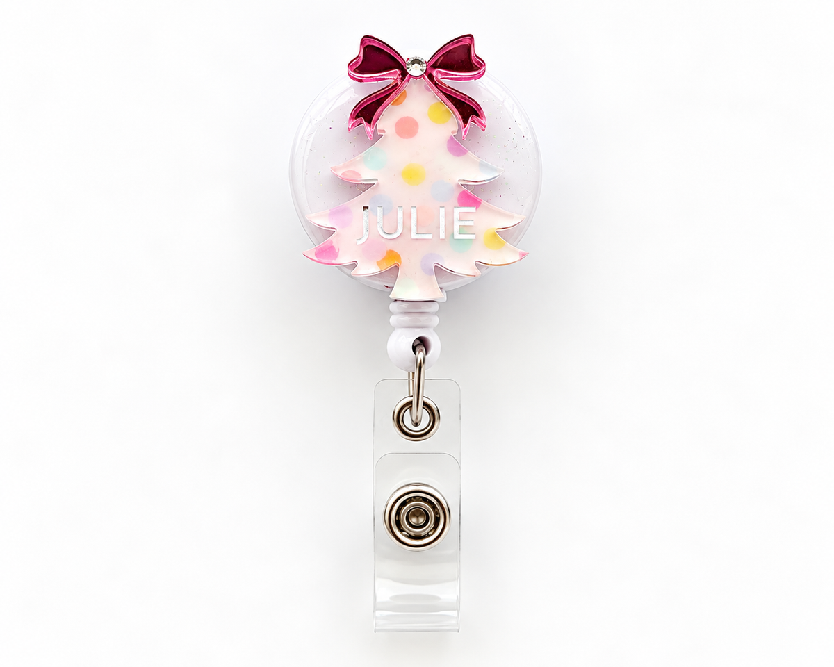 Pastel polka dot Christmas tree badge reel with pink mirrored bow and personalised name