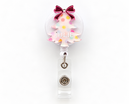 Pastel polka dot Christmas tree badge reel with pink mirrored bow and personalised name