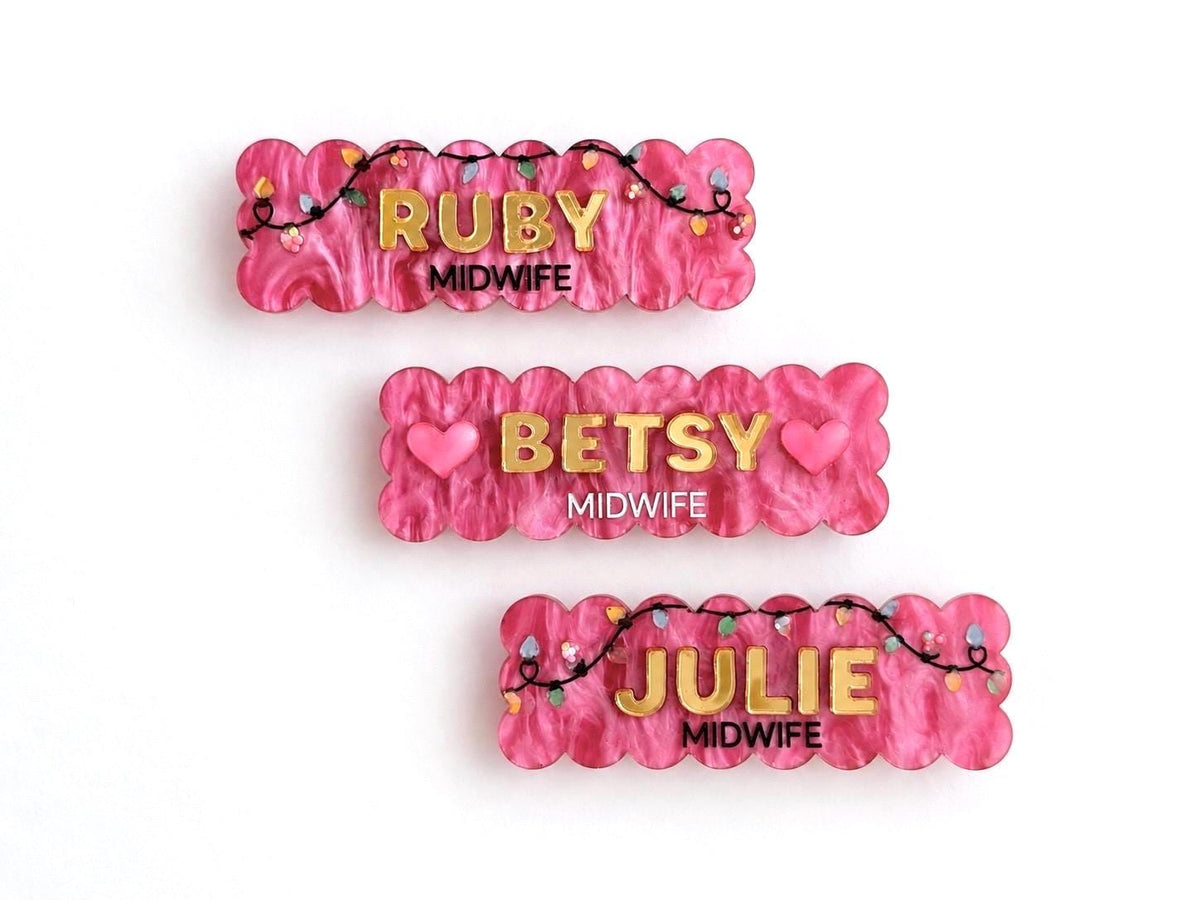 Pink scalloped Christmas lights name badges for midwives Ruby, Betsy and Julie