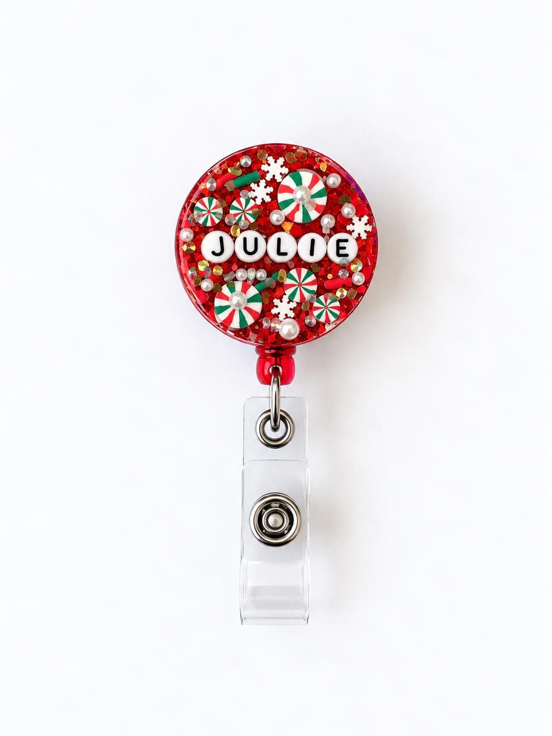 Red Christmas letter bead badge reel with the name Julie in white letter beads
