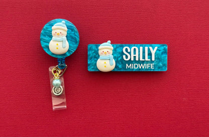 Snowman Christmas badge reel shown with a matching Sally Midwife glitter name badge